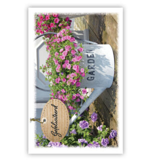 Witte gieter met roze bloemetjes